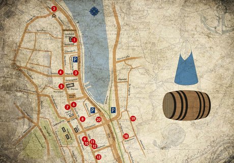 Auf einer Karte, auf der ganz schwach maritime Zeichnungen zu sehen sind, ist die Rum und Zucker Meile farbig abgebildet. Daneben das Logo für die Meile. Dieses besteht aus einem Zuckerhut und einem Rumfass.